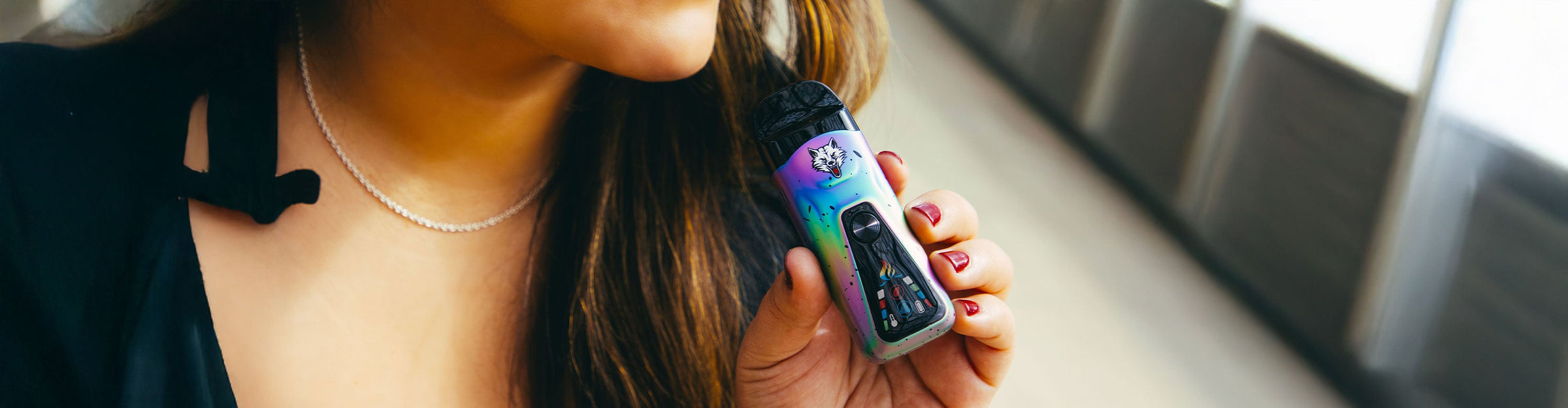 woman holding the Wulf Flex Dry Herb Vaporizer outside near park